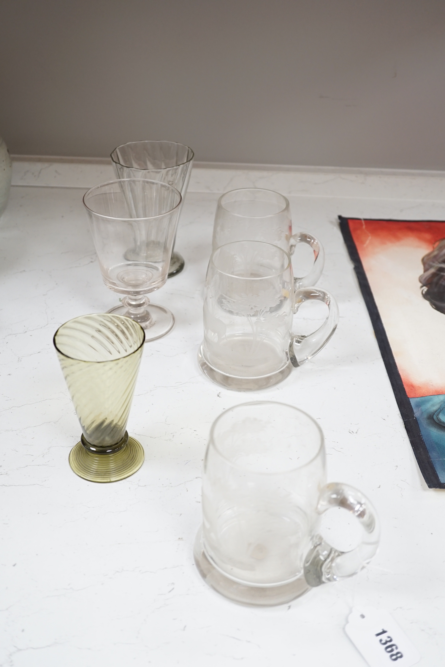 A set of four engraved glass mugs, a pair of rummers, an oval biscuit box etc